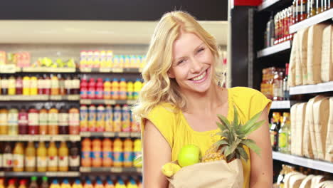 Pretty-blonde-with-paper-bag-doing-thumbs-up