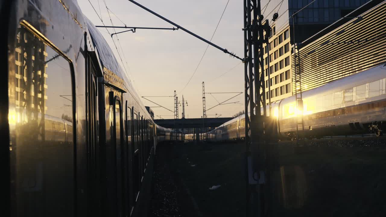 Outside the window shot of Berlin's busy train tracks during sunrise