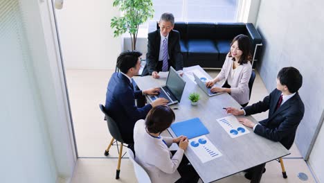 business persons working in an office