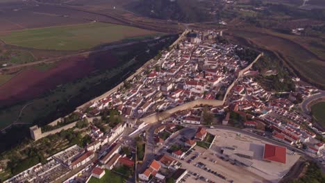 wide shot of medieval town obidos with wall and fortress, portugal