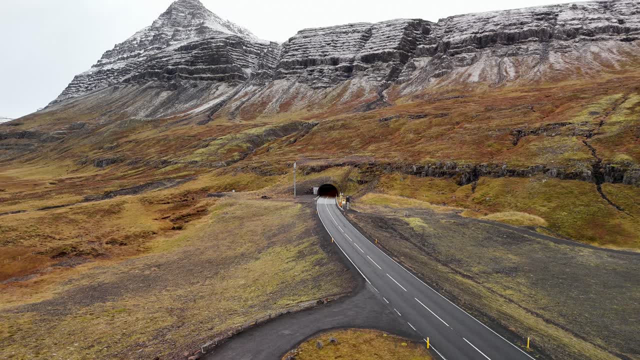 Bus driving through a tunnel in the Icelandic mountains