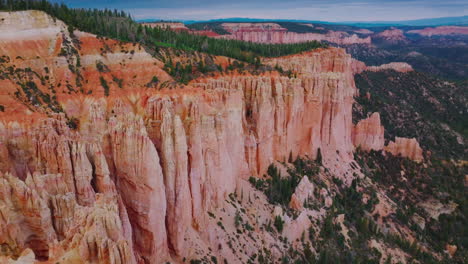 fascinating coral rocks of bruce canyon national park in utah, usa. pine trees growing on top of the mountains.