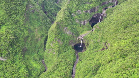 high above the takamaka waterfalls on the marsouins river, reunion island