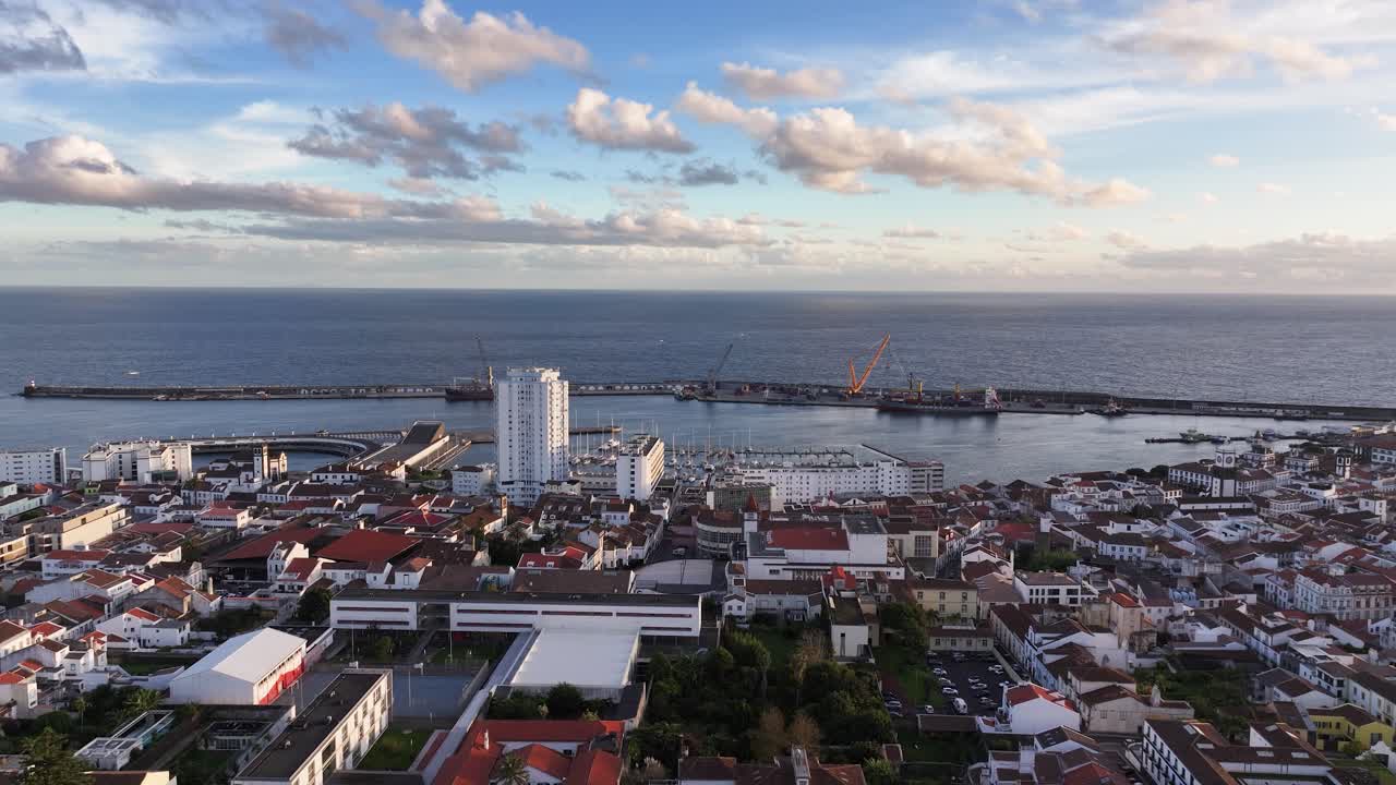 Aerial View of a Coastal City with Harbor and Ocean
