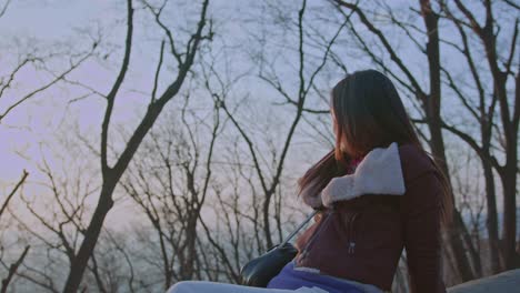 Beautiful-lovely-cute-asian-korean-chinese-japanese-female-girl-woman-model-acts-on-camera-outdoors-in-the-park-exposing-to-sunlight