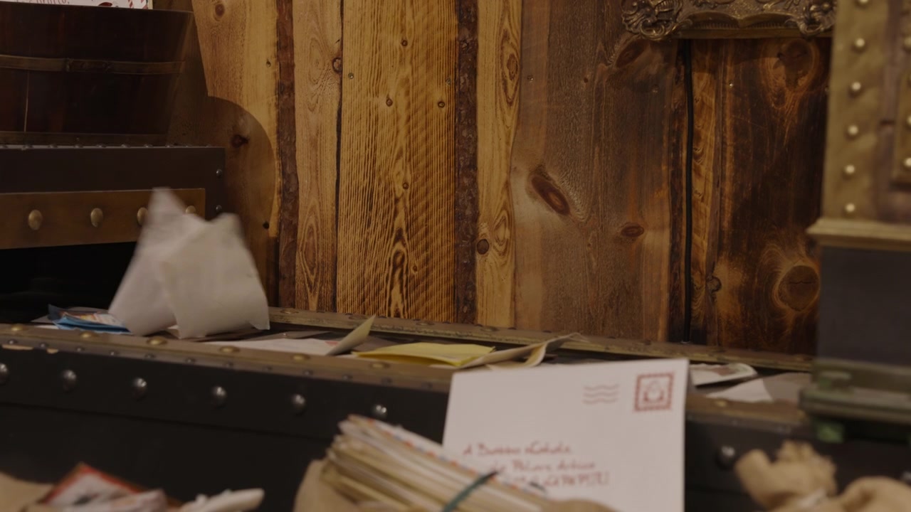 Letters Falling from a Mail Slot onto a Conveyor Belt