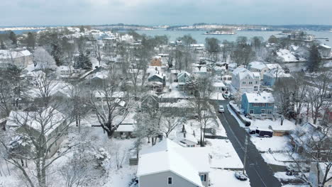 aerial drone footage in hingham, ma after snowstorm, hingham, weymouth and quincy bay in distance