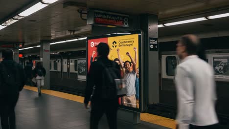 dynamic subway scene featuring a vibrant advertising display for cryptocurrency exchange, highlighting enthusiastic participants celebrating in a busy commute environment