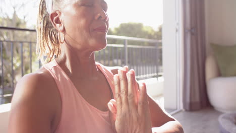 A-senior-African-American-woman-with-grey-hair-is-meditating