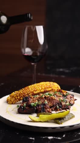 grilled pork ribs with corn and pickles and wine