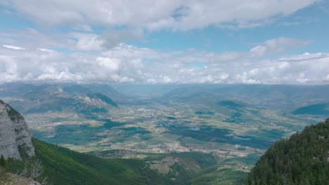 High-altitude-view-of-valley-with-clouds,-French-Alps