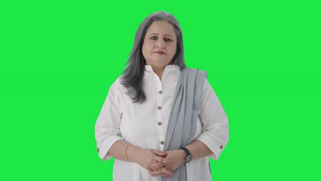 Serious-Indian-senior-businesswoman-starring-Green-screen