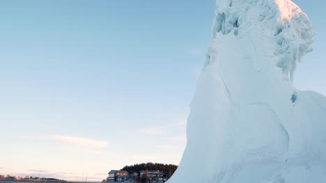 tall iceberg inside small town in northern sweden, shot from below on a tripod during sunsrice