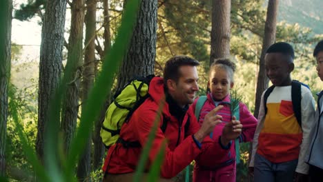 Kids-and-teacher-studying-botany-on-a-field-trip-4k