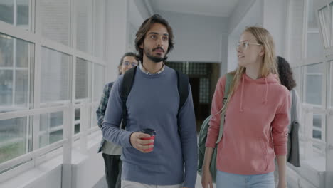 students walking in a university hallway