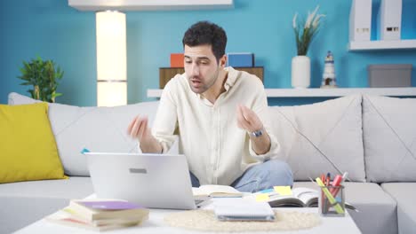 Angry-young-man-arguing-in-video-chat-on-laptop.