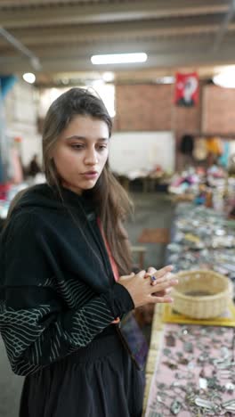 woman browsing items at a flea market