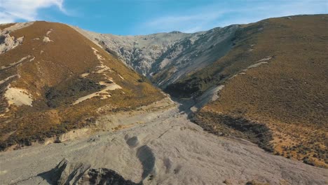 Aerial-Drone-View-of-Edwards-River-in-New-Zealand,-Mountains-in-the-Background