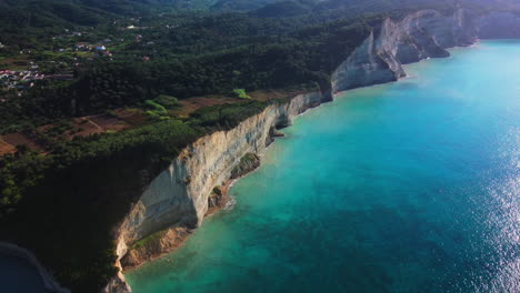 Flight-over-high-cliffs-of-sea-coast,-aerial-view