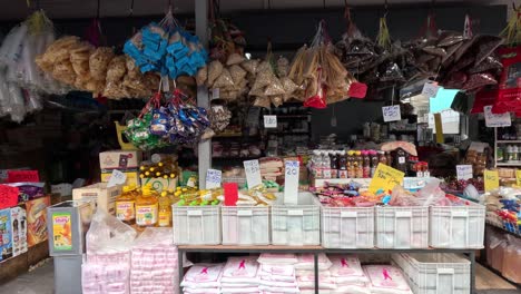 shopper browsing through a colorful market stall