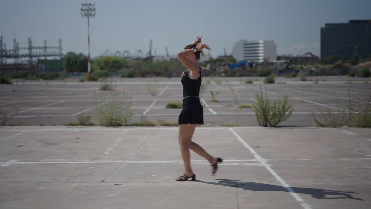 Woman Walking in Empty Parking Lot