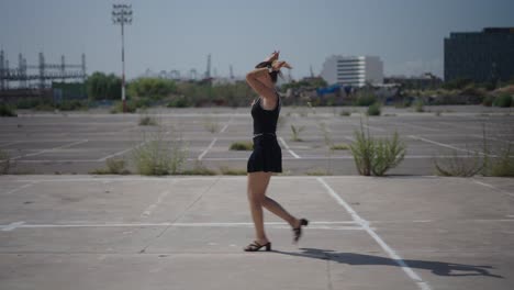 woman walking in empty parking lot