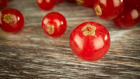 super close macro of a redcurrants on a wooden table.