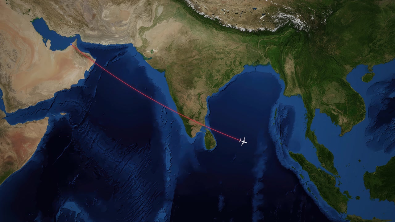 Satellite map animation tracks a commercial airplane flying from Dubai to Kuala Lumpur over Asia