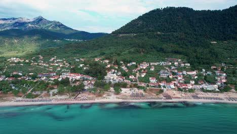 aerial view of golden beach after a storm with an algae line close to the beach,lush vegetation, vivid colors, high mountain peaks, thassos island, greece, europe