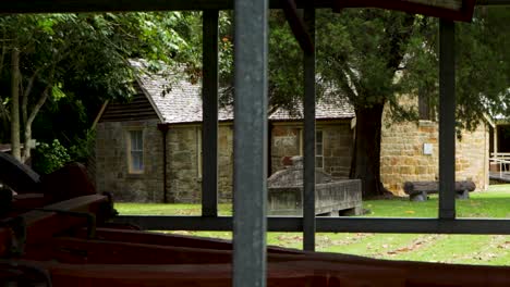 cottage house viewed behind horse wagon