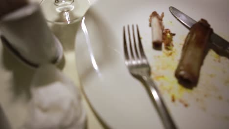 dirty dish on food table. wasted food on served festive table after dinner party