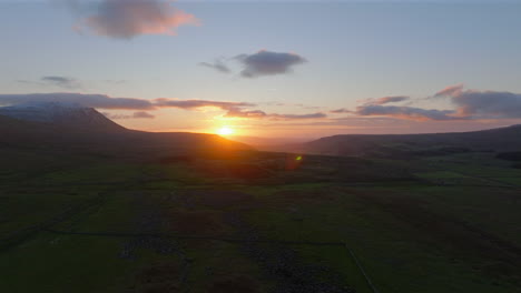 wide angle drone shot of yorkshire dales and ingleborough at sunset uk