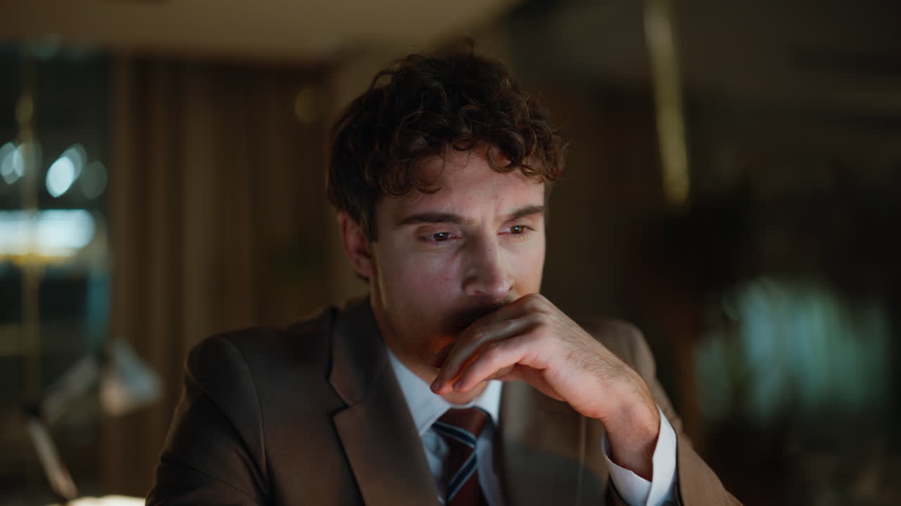 Closeup manager working night texting computer keyboard. Man reading contract