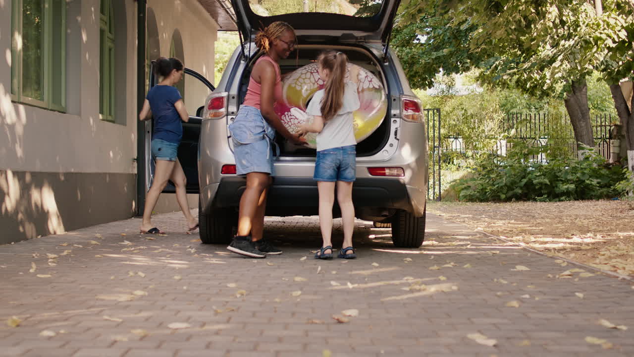 Family Vacation: Packing Luggage into the Car