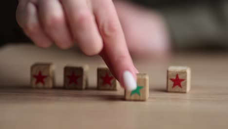 rating with stars on wooden blocks