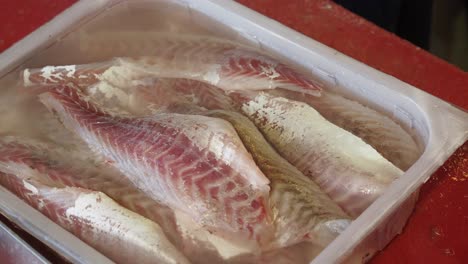 close up of fresh raw fish fillet in a tray