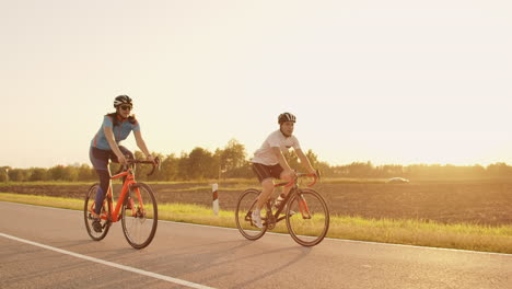 Tracking-shot-of-a-group-of-cyclists-on-country-road.-Fully-released-for-commercial-use.