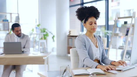 typing, serious and computer with woman in office