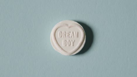 heart candy with dream boy message on blue background