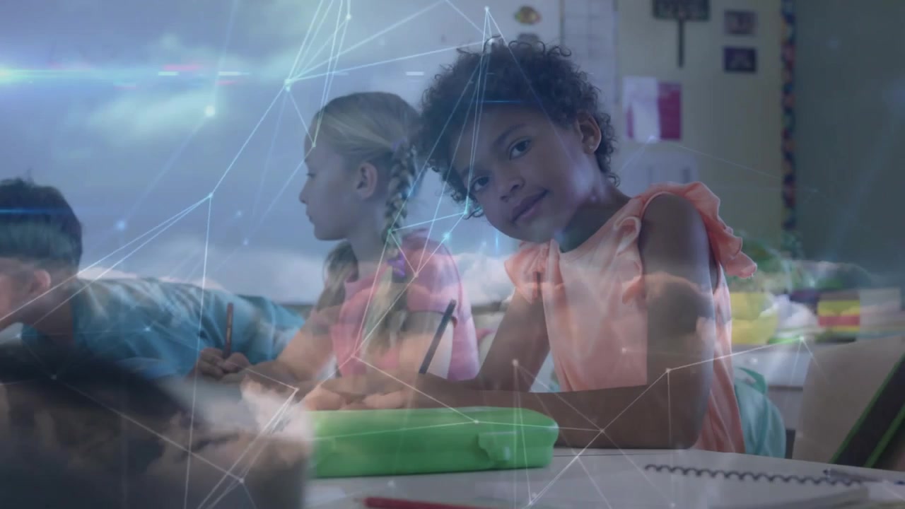 Curly-haired girl shifting from writing to smiling in classroom, camera focusing, overlay glowing