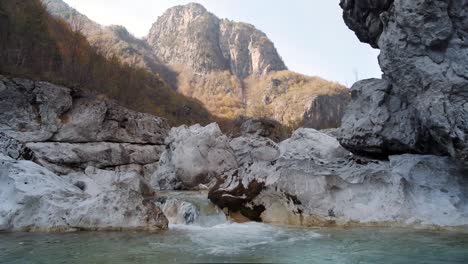 hiking around theth to the blue eye, grunas waterfall and in the albanian alps during fall season or autumn season