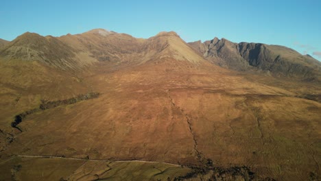 High-level-pull-away-from-Red-Cuillin-mountains-at-sunset-at-Glenbrittle-Isle-of-Skye-Scotland