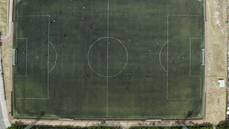 locals get together for a sunday afternoon soccer match in manzanares spain - aerial birds eye footage of the game in progress