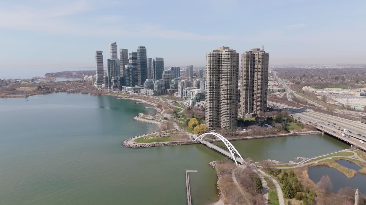 Humber Bay Arch Bridge In Sir Casimir Gzowski Park, Toronto, Ontario, Canada. Aerial Pullback Shot