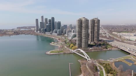 humber bay arch bridge in sir casimir gzowski park, toronto, ontario, canada. aerial pullback shot