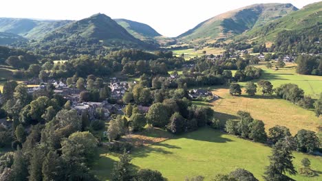 aerial video footage grasmere village, town in the cumbrian lake district national park england uk on a beautiful sunny day