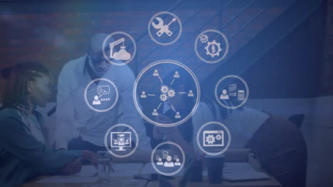 Animation of network of icons over diverse business people in office