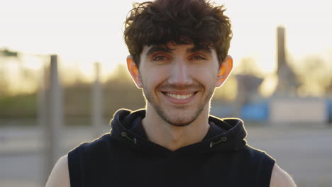 portrait of a smiling young man outdoors