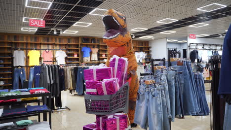 dinosaur inflatable with gifts in a clothing store