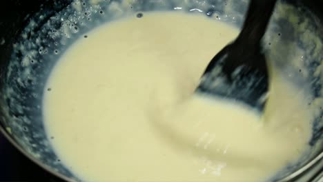 stirring boiling milk reducing milkalai